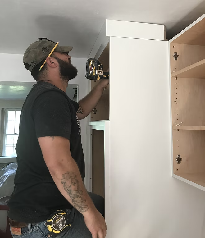 Sardina Custom Remodeling installing custom cabinetry in a MetroWest MA home